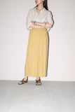 early work of DRIES VAN NOTEN, pleated front design wrap pencil skirt in beautiful pale yellow color