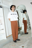 80's linen tuck trousers in dusty orange