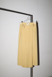 early work of DRIES VAN NOTEN, pleated front design wrap pencil skirt in beautiful pale yellow color